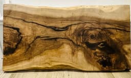 Customer photo from an Etsy review of Live Edge Walnut Single Slab Dining Table
